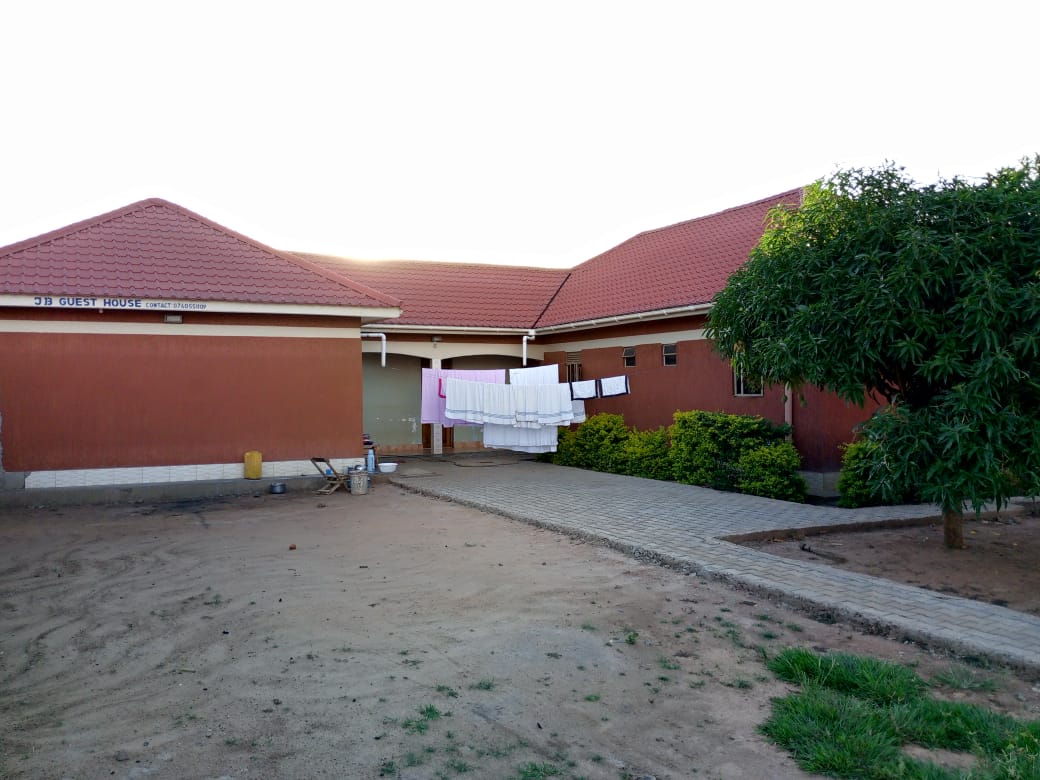 JB Guest House exterior with signage